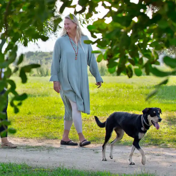 Marie Walking with Dog in Retreat Center Suniai Oliva 